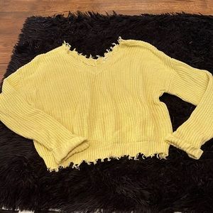 Bright yellow frayed sweater